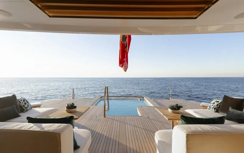 The forward sundeck lounge and plunge pool, looking aft along the superstructure.