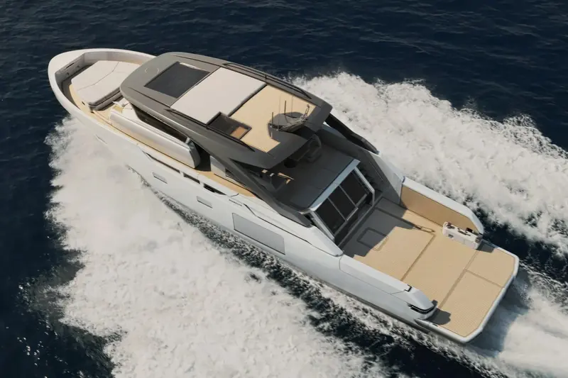 The Bluegame BG64 running at speed, seen from above, with the open bow lounge and side terraces that define the yard's layout.