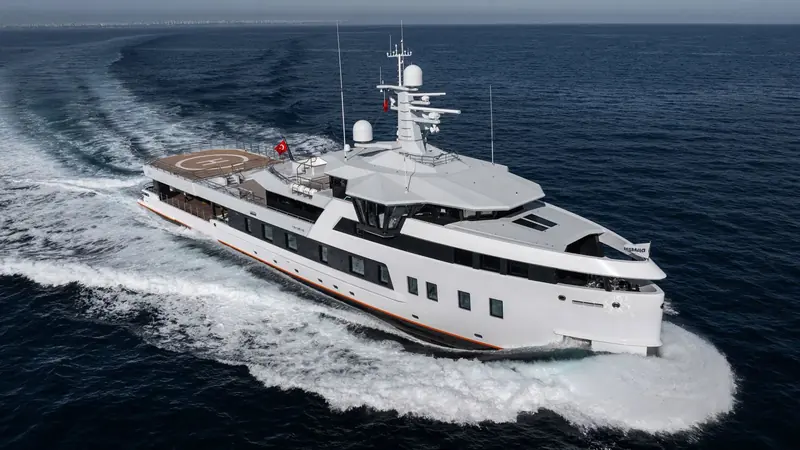 Damen Yachting's Xplorer 60 After You under way, her ice-classed steel hull and raised crow's nest visible.