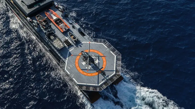 An aerial view of After You under way, showing the helideck and expedition-yacht deck plan.