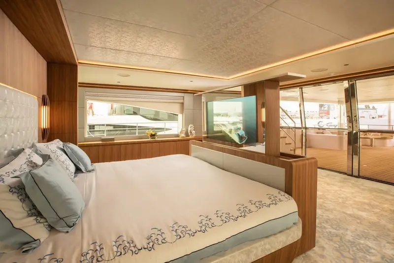 The owner's suite is set forward with a centreline berth and warm wood panelling, finished to the same standard Gulf Craft applies across its Majesty flagships.