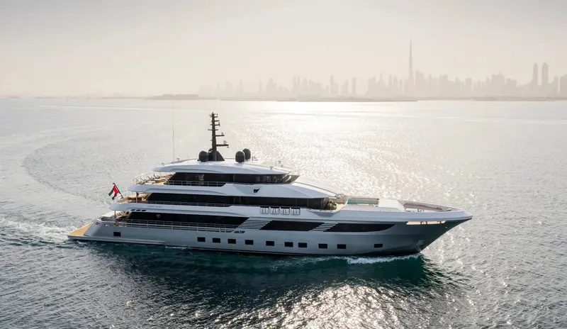 Under way against the Dubai skyline, the three-deck superstructure and near-vertical bow show the full-displacement hull shape Gulf Craft moved to for its largest models.