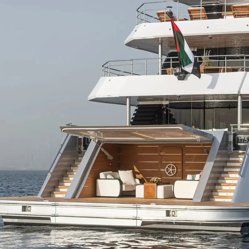 A folding transom platform and stepped aft deck give direct water access without the tender-garage compromise smaller flagships are forced into.