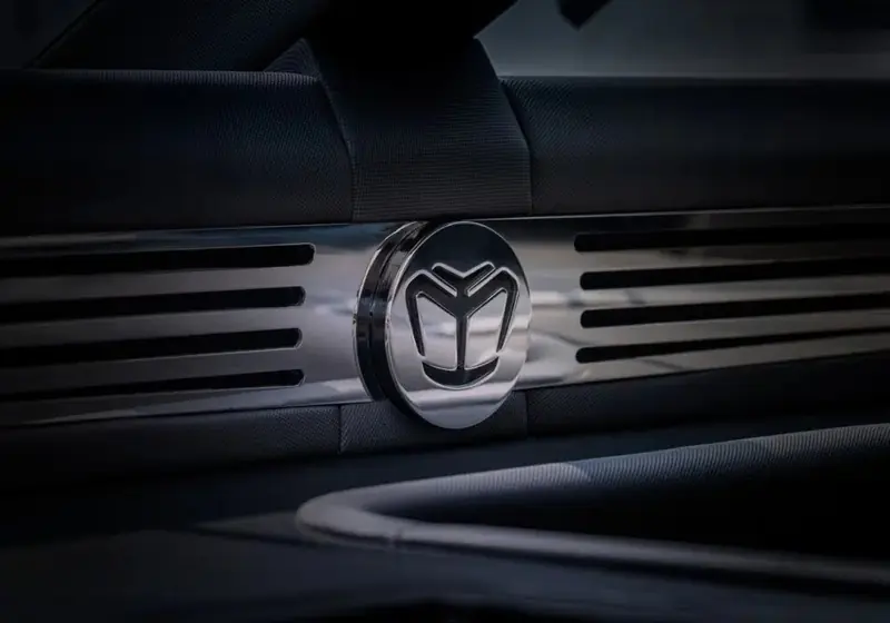 A close detail of the Majesty Yachts badge set into dark trim on the transom.