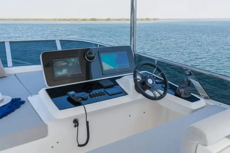 The lower helm console, twin multifunction displays mounted either side of the wheel for navigation and engine monitoring.