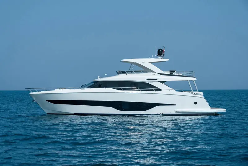 Majesty 72 at rest in flat water, hull and superstructure lines shown clean in profile with no backdrop to distract from the shape.