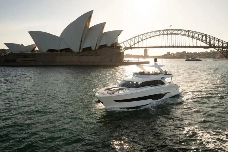 Passing the Sydney Opera House and Harbour Bridge, one of several harbour cities this press set was shot in.