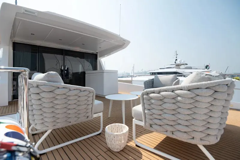 Loose chairs on the aft deck under the overhang, the shaded end of the boat and the one most owners use at anchor.