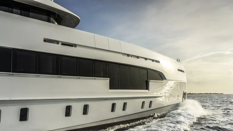 Under way, the vertical bow and low sheer line show the aluminium construction that keeps a 50-metre hull light enough to reach higher speeds than a steel-built equivalent.