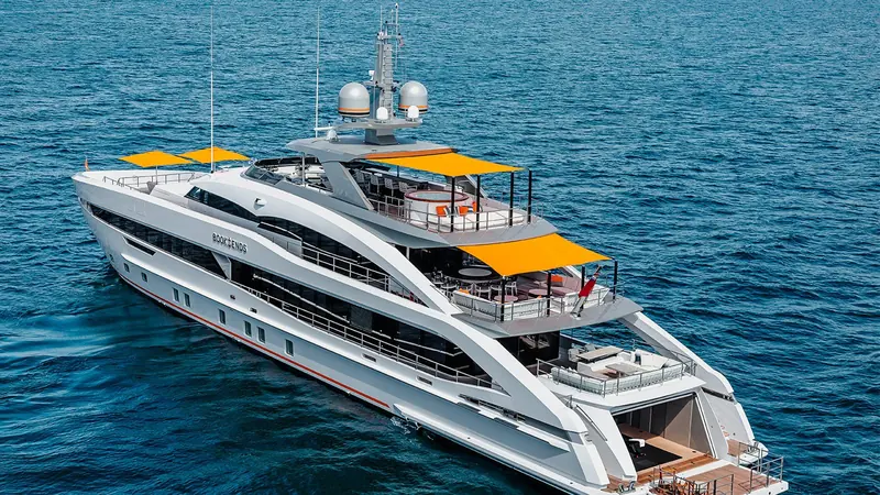 Twin orange awnings shade the bridge deck and sun deck, a signature the owner carried over from his previous Heesen.