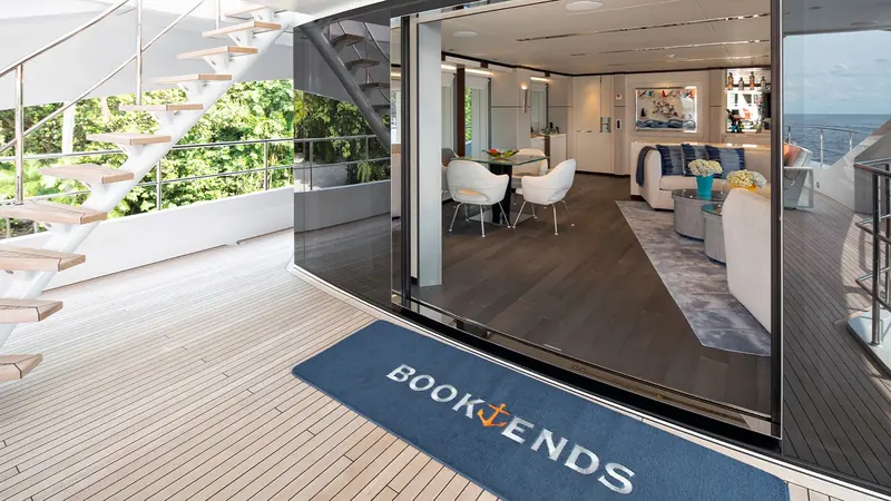 A private cockpit off the owner's deck, screened by planting and reached by its own spiral stair.