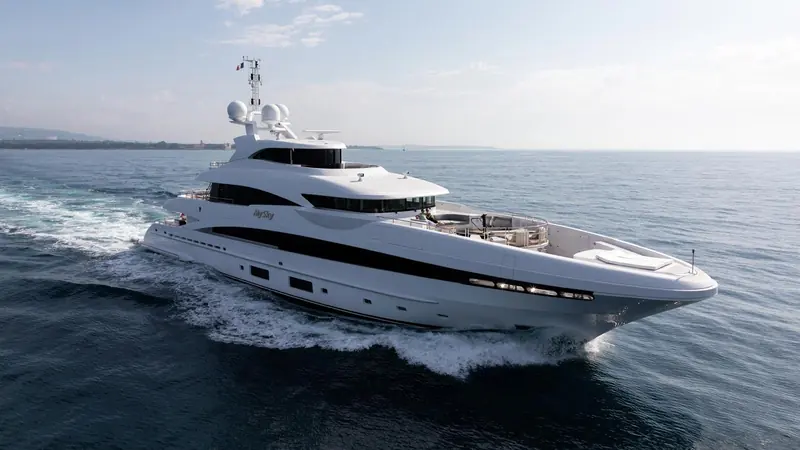 Under way in open water, the reverse sheer and stepped superstructure are Heesen's own styling, distinct from the raked bows most yards use on a fast-displacement hull.