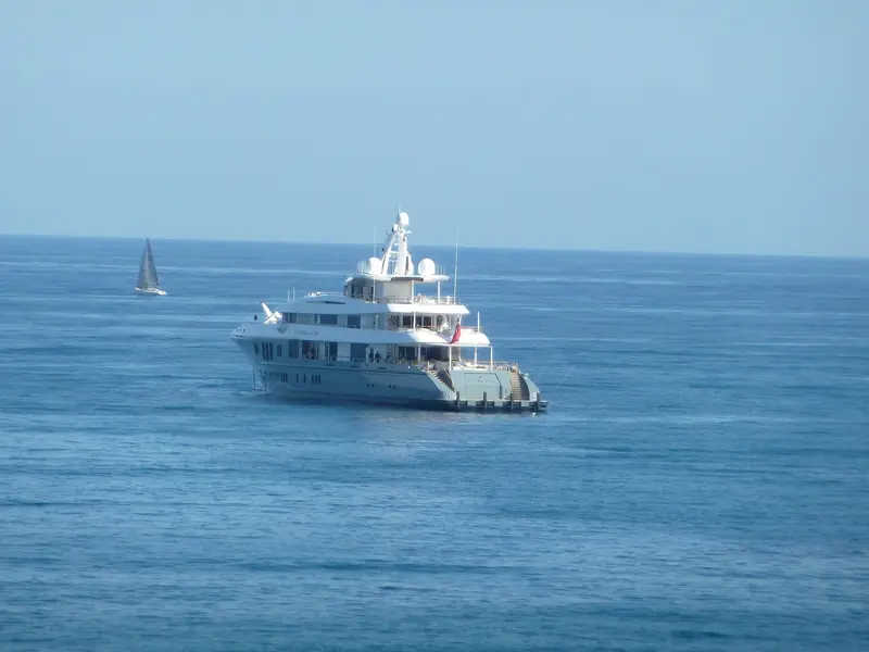 A closer pass off Antibes, name visible on the hull side aft of the bridge.