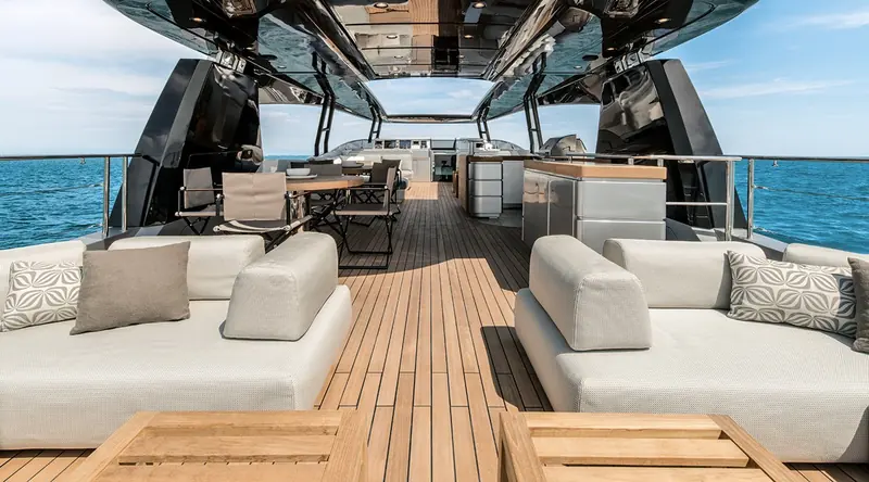 The flybridge dining and lounge area, one of the largest open-air decks in Monte Carlo Yachts' range at this length.