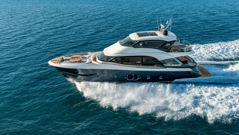 Bow-on running shot, the wide foredeck lounge and single-pane windscreen that mark Nuvolari Lenard's exterior styling.