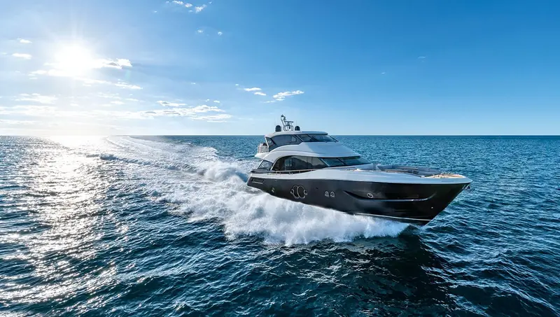 Running in open water off the Ligurian coast, the sky lounge's glazing catching the light along the full length of the upper deck.