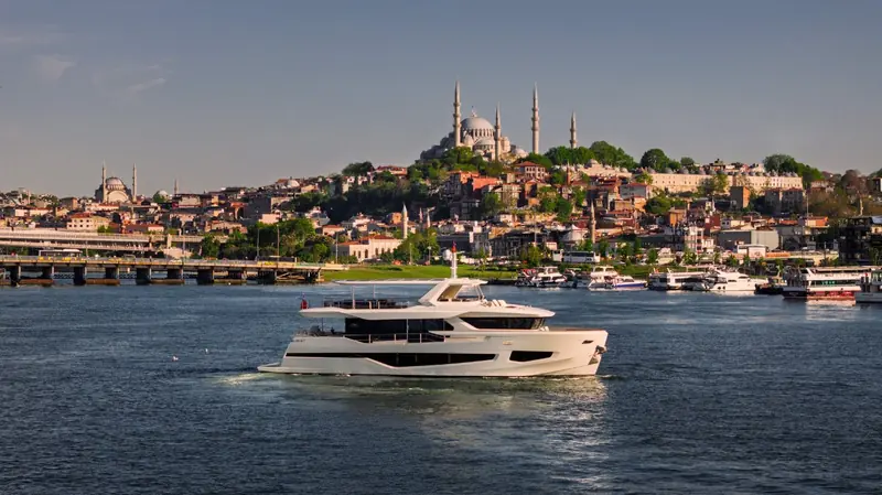 A Numarine motor yacht on a delivery run past Istanbul's Suleymaniye Mosque - Numarine builds and sea-trials every hull on the Bosphorus before it ships to its owner.