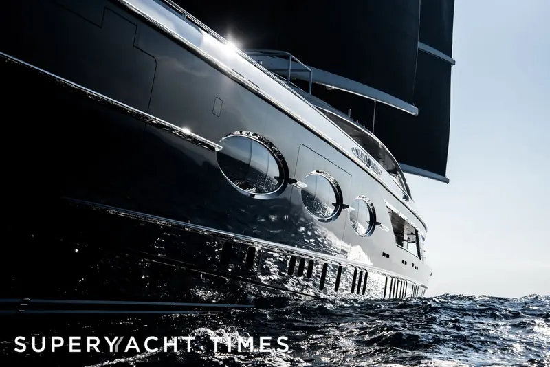 A close bow view showing the yacht's dark hull coating and portlights; Black Pearl's hull was finished in a dark colour rare on a yacht this size.