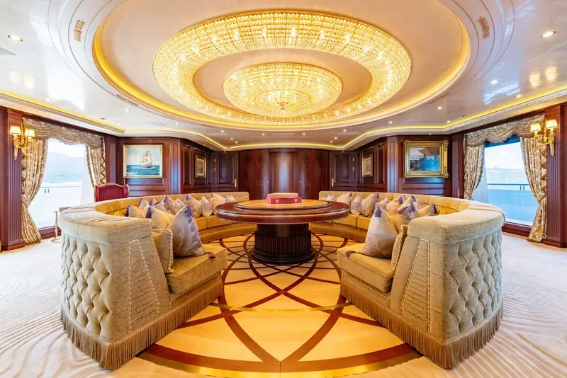 One of the interior saloons, finished in a traditional style that contrasts with the yacht's technically radical rig and hull.