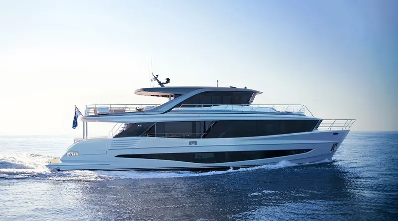 A bow quarter view at cruising speed. The boat is running with very little bow rise, which matters more than it looks: it is what keeps the sightline from the lower helm usable as the hull comes up on to the plane.