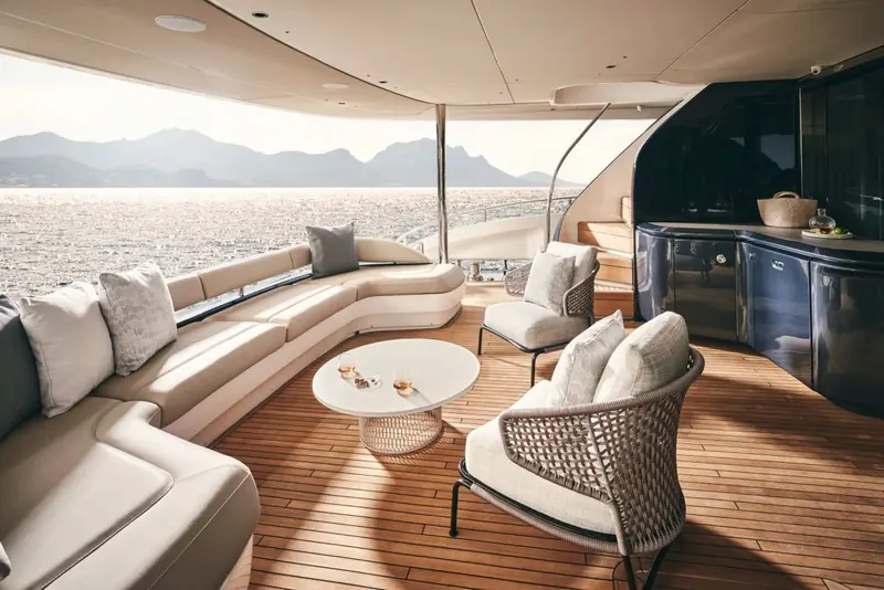Aft flybridge seating under way, with a wet bar built into the port side for entertaining outdoors.