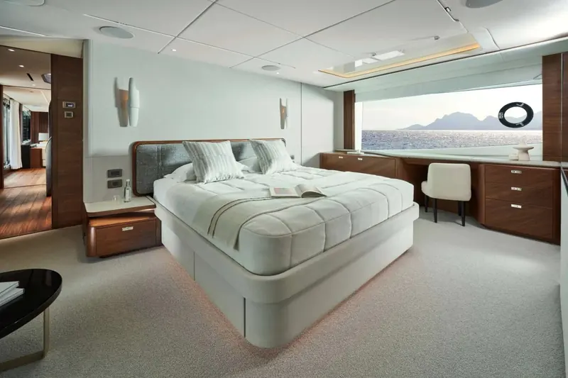 The master stateroom, full-beam windows and a private desk, positioned amidships for the least motion at sea.