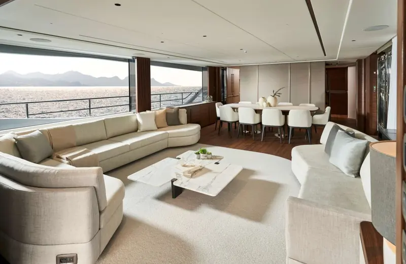 Saloon and dining area combined, seating for eight at the table with the galley through the port doorway.