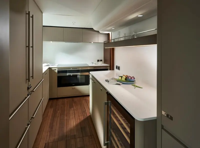 The galley, full-size appliances and a wine cooler built into the run of units.