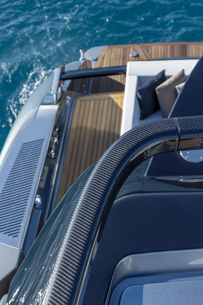 Detail of the carbon-fibre roof support and aft deck teak, taken from the flybridge looking down.