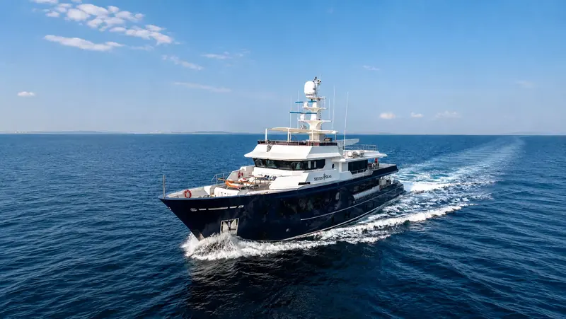 Seven Seas underway off the Turkish coast, the 36.86m explorer's dark hull and raised pilothouse visible from the bow quarter
