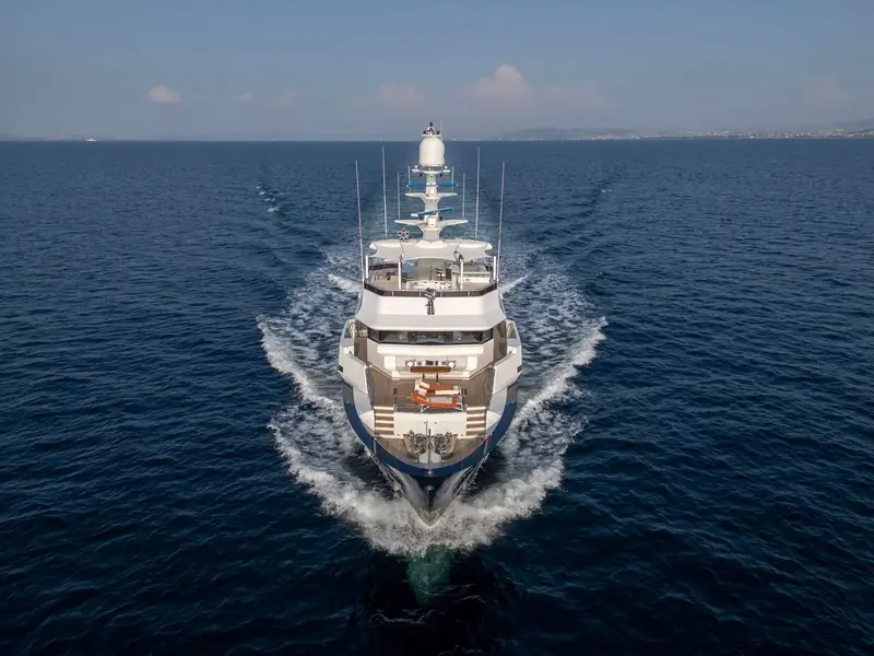 Seven Seas seen from directly ahead at speed, twin bow wakes breaking either side of the reinforced explorer bow