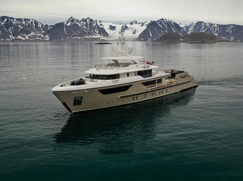 At anchor in a glacial fjord, the raised pilothouse, full-length lower-deck window band and stepped superstructure that set the 500EXP apart from Sanlorenzo's planing SL and SX ranges.