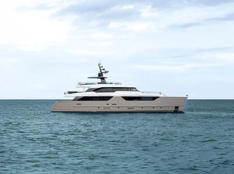 The SD118's champagne-hulled profile at anchor, showing the stepped sheerline and full-beam windows that carry Zuccon International Project's semi-displacement lines up to 36 metres.