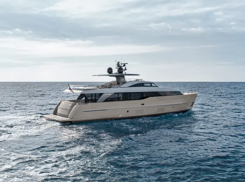 The Sanlorenzo SD90 underway, showing the semi-displacement hull's flared bow and low profile.