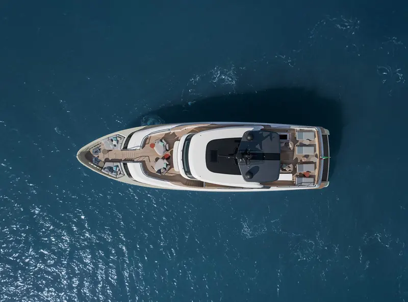 Seen from directly overhead, the SD96's side decks run unbroken from the bow lounge to the transom garage, wide enough to pass a guest without disturbing anyone seated.
