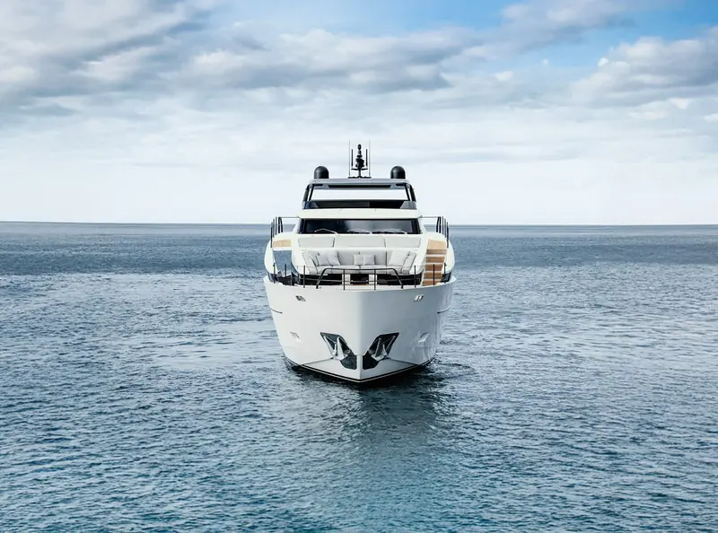 Bow-on view, showing the model's flared entry and dark-glazed pilothouse.