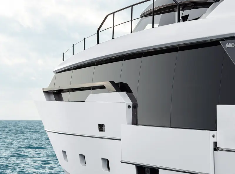 The stern quarter, showing the fold-down bathing platform and the asymmetric side-deck arrangement.