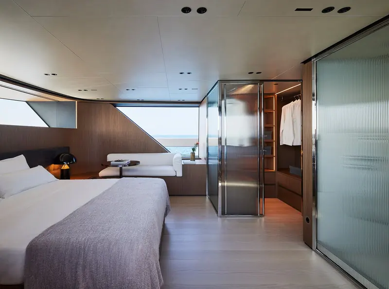 A guest cabin with a private ensuite visible through a glazed partition.