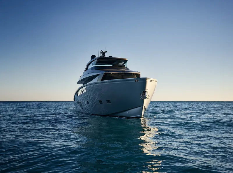 A stern quarter view at rest, swim platform low to the waterline.