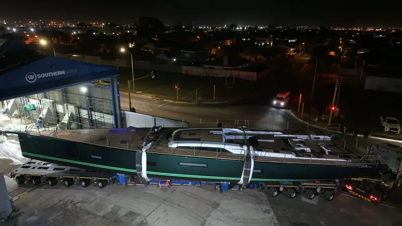 An aerial night view of Fortissimo under transport at the Southern Wind yard, Cape Town.