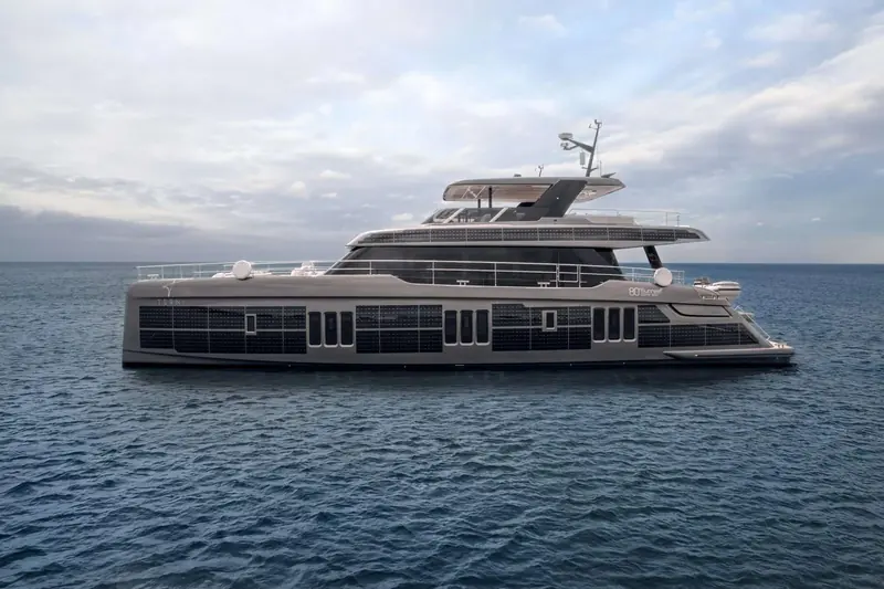 The delivered 80 Sunreef Power Eco, Tesni, at rest, solar panels tiling the topsides and model nameplate visible amidships.