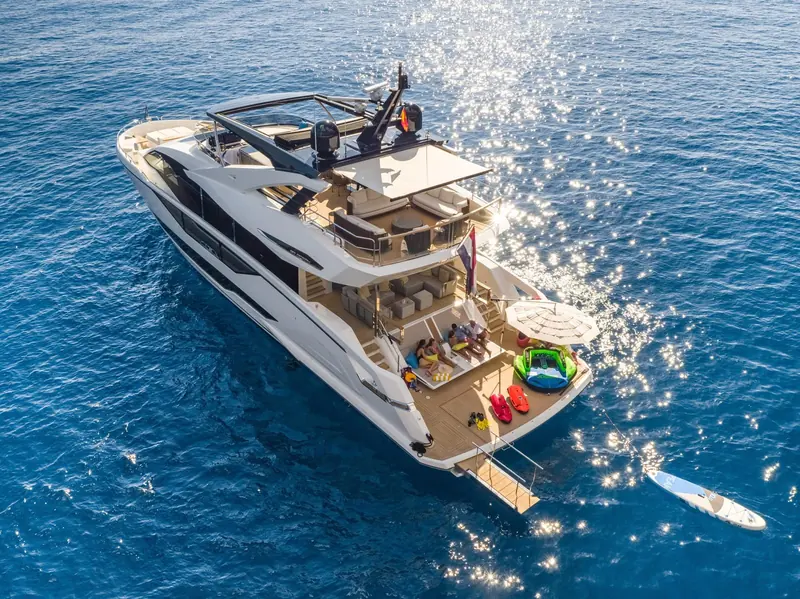 Aerial view of the swim platform and cockpit, tender stowed in the garage beneath the aft sunpad.