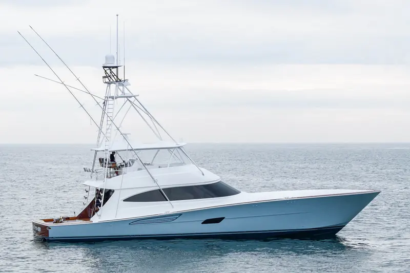 A Viking 82 Convertible under way, tower and outriggers rigged for tournament fishing.