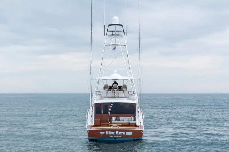 The Viking 82 Convertible seen from astern, her transom lettered VIKING.