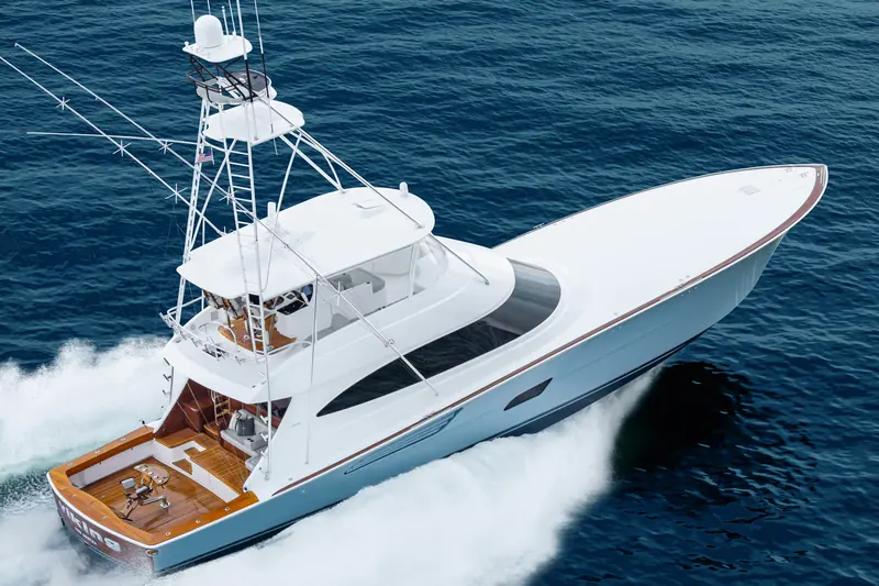 A Viking 82 Convertible at speed, the 229-square-foot teak cockpit and tuna tower visible from above.