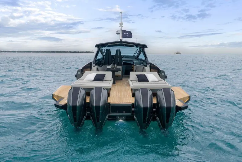Head-on, the quad outboard-style stern drives and wide transom sun-pads show the layout Wally chose over a single inboard driveline for this size of performance boat.