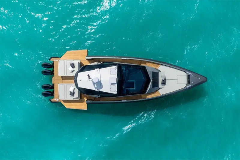 From directly above, the helm sits forward under a hardtop while the whole aft two-thirds of the deck is left open as a sunbathing and lounge area.