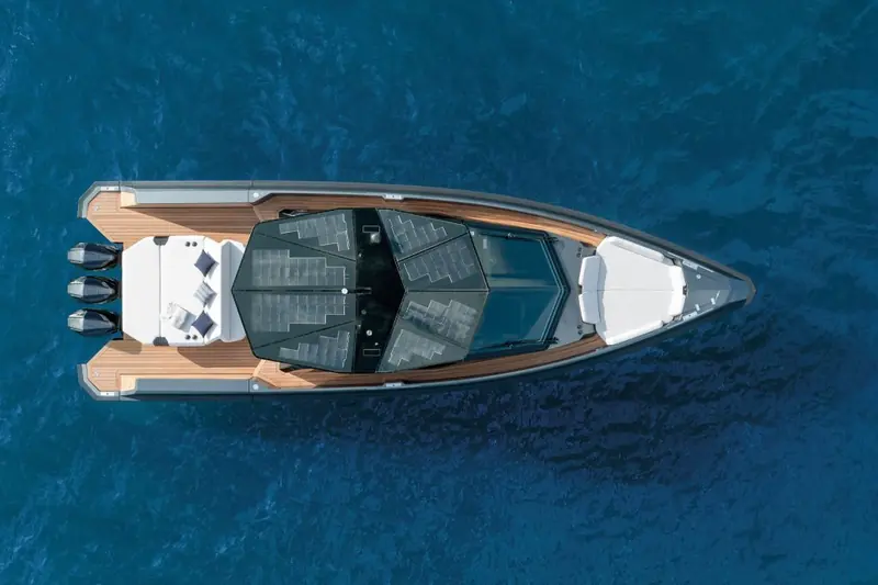 Overhead view of the full deck layout: forward seating, centre helm and open aft cockpit with the swim platform extended.