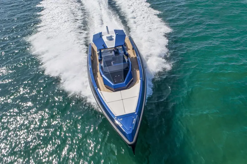 Overhead running shot showing the full deck plan: forward sunpad, centre console and open aft cockpit.