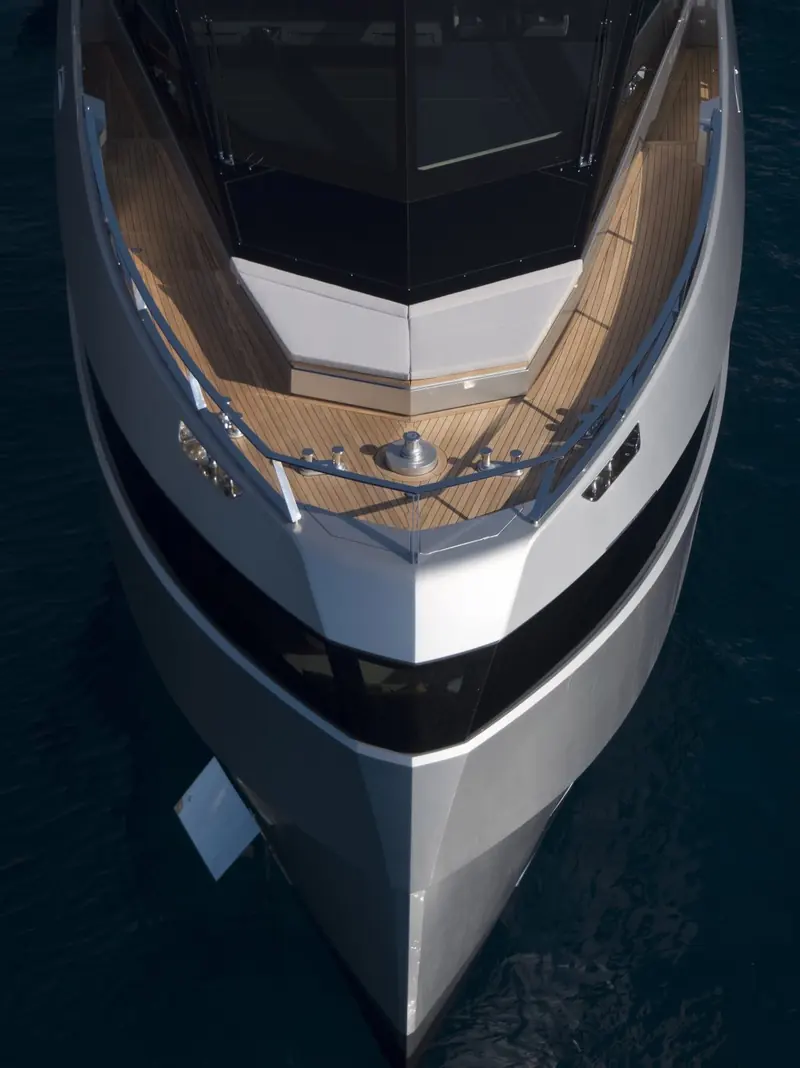 Bow-on at speed, the sharply raked windscreen and near-vertical stem giving the hull its distinctive wedge-shaped silhouette.